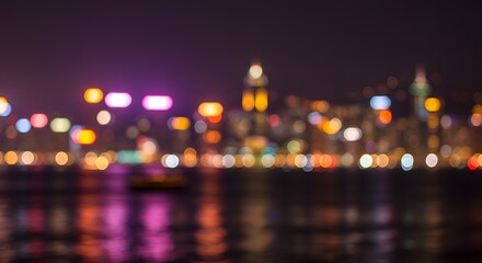 Blurred city lights of Hong Kong at night, creating a vibrant bokeh background with neon glow and urban energy.