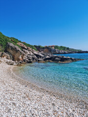 Fototapeta premium Turqouise waters at Porto Skala Beac - the best beach for snorkeling in Southern Kefalonia near Poros and Skala, Kefalonia island, Greece