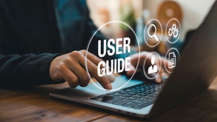 Person using laptop for user guide support and technical documentation access online.
