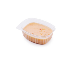 Creamy dip in a plastic container ready for an outdoor gathering