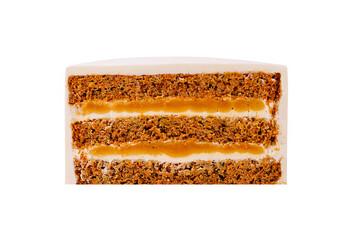 Layers of carrot cake with cream cheese frosting and caramel drizzle