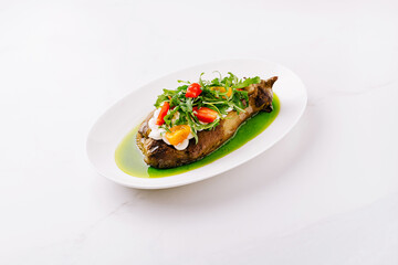 Delicious grilled eggplant topped with fresh herbs and colorful vegetables