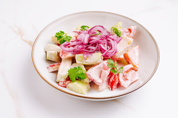 Colorful garden salad with fresh vegetables and creamy dressing