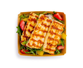 Grilled cheese served over fresh salad with vibrant vegetables