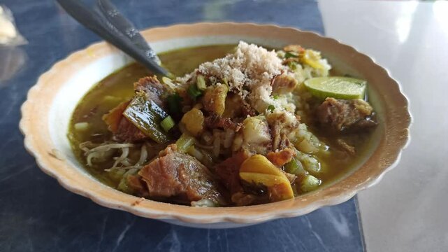 Soto babat sapi is a rich Indonesian beef tripe soup with bold spices&mdash;served hot with rice, lime, and sambal for a hearty traditional meal.