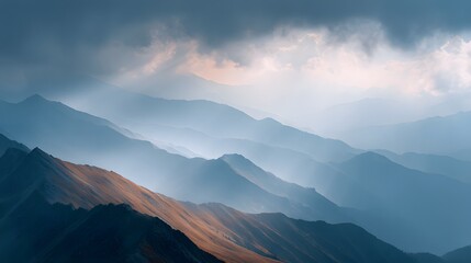 Obraz premium High mountain ridge with dramatic clouds and rays of light