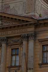 A grand building featuring impressive columns and a prominent sign that reads xgv mdccci, showcasing its architectural beauty