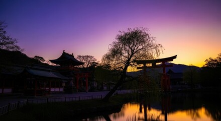 Scenic Traditional Japanese Temple Landscape During Sunset with Vibrant Sky and Silhouetted Trees