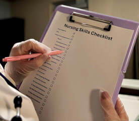 Nurse Completing Clinical Skills Checklist with Gloved Hands