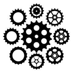 Black bicycle sprockets and gears arranged on white bicycle gears mechanical parts