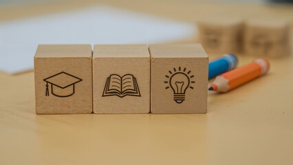 Educational wooden blocks symbolizing graduation knowledge and innovation with warm desk on transparent background