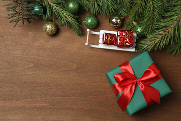 Gift boxes, New Year toys, New Year tree on wooden background