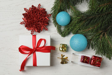 Gift boxes, New Year toys, New Year tree on white wood