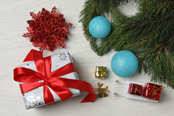 Gift boxes, New Year toys, New Year tree on white wood