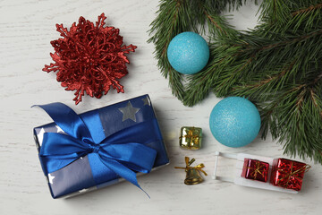 Gift boxes, New Year toys, New Year tree on white wood