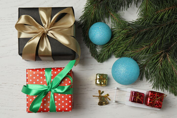 Gift boxes, New Year toys, New Year tree on white wood