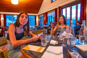 Happy family paying at the restaurant