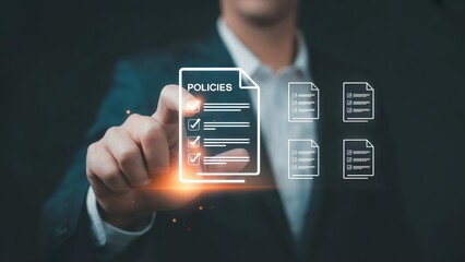A businessman is viewing company policies and regulatory compliance online.