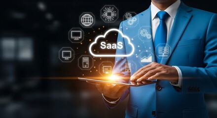 Azure suited executive holds glowing tablet SaaS cloud tech icons corporate future vision with cutting edge digital
