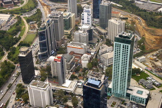 Aerial view of skyscrapers piercing the sky, juxtaposing against the urban tapestry of roads and greenery, creating a vibrant panorama, Istanbul, &Auml;&deg;stanbul, T&Atilde;&frac14;rkiye.