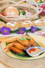  chicken wings fried until golden brown, crispy on the outside, soft on the inside, served with spicy dipping sauce or sweet chicken dipping sauce.