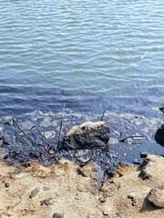 Environmental disaster .Oily surface of the sea