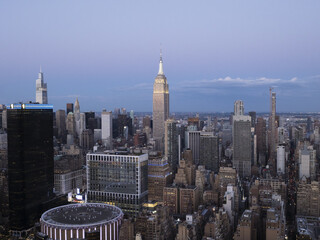 Aerial view of the Empire State Building, Madison Square Garden and New York cityscape upon the twilight sky, New York, United States