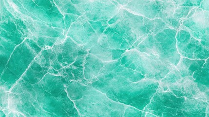 Fototapeta premium A close-up image of a textured surface resembling cracked turquoise marble with white veining details.