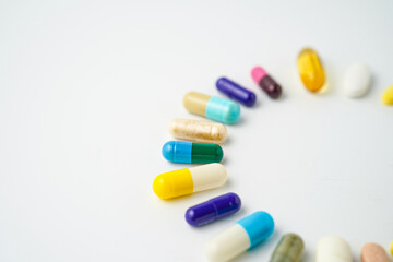 Clock made of pills capsules, pills form a circle, omega, vitamins, Cod liver oil, supplements