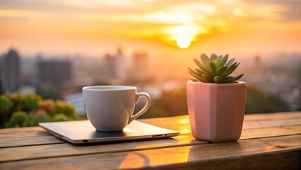 Photo of a steaming cup of coffee rests on a tablet next to a succulent plant on a wooden table during a vibrant sunrise