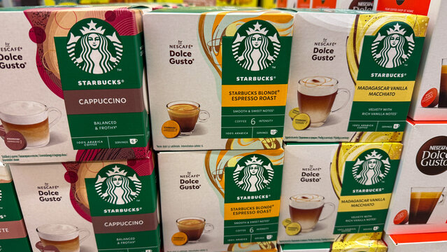 Enticing coffee Starbucks  pods display, aromatic java paradise, velvety cappuccino dreams for International Coffee Day and Caffeine Connoisseur's Celebration June 5, 2025, Belgrade, Serbia