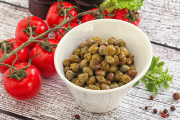 Marinated green capers in the bowl