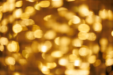 cream background with elegant gold bokeh particles