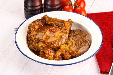 Italian cuisine - ossobuco with sauce