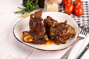Prepared tasty beef ribs with sauce