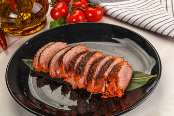 Sliced duck breast baked with cherry