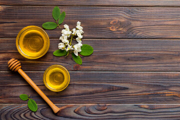 honey jar with acacia flowers and leaves. fresh honey top view flat lay