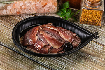 Canned anchovy with oil in the bowl