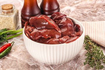 Raw uncokked chicken liver in the bowl