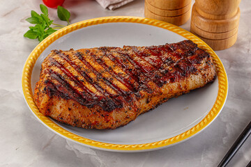 Grilled pork steak with bone