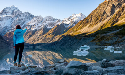 Hooker valley scenery with unrecognisable hiker in Aoraki Mt Cook National Park