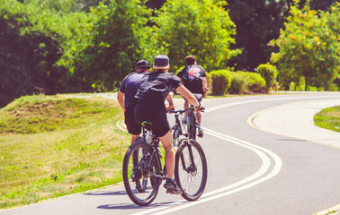 Cyclists ride on the bike path in the city Park
