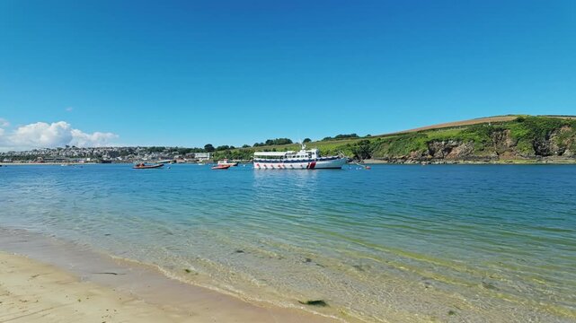Pan from left to right of view across estuary of Padstow from Daymer Bay, Cornwall, UK
