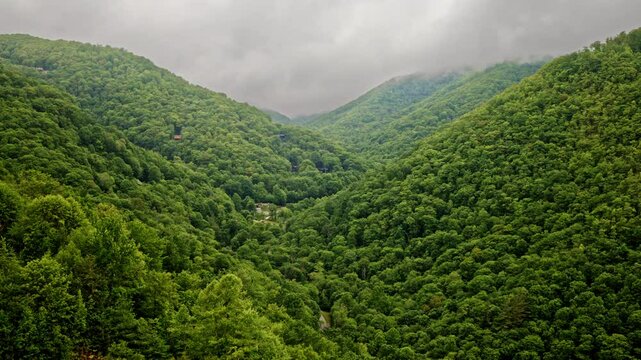 Cinematic bird&rsquo;s-eye view of fog lacing the Smoky Mountains