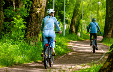Cyclist ride on the bike path in the city Park
