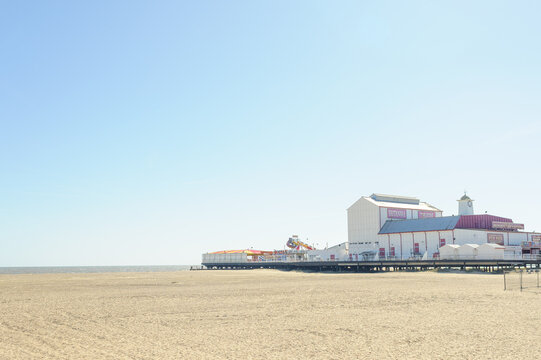Great Yarmouth, Norfolk, UK - 6th April 2025: Great Yarmouth's famous pier is a traditional style wooden pier filled with amusements and funfair rides.