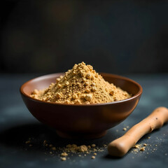 Liquorice root stick or jeshthamadh powder served in a bowl over moody background