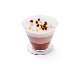 Chocolate and cream dessert in layered glass cup with toppings