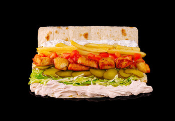 Delicious wrap filled with grilled chicken, fresh vegetables, and sauces