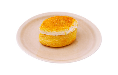 Delicious dessert featuring a fluffy pastry topped with sweet cream